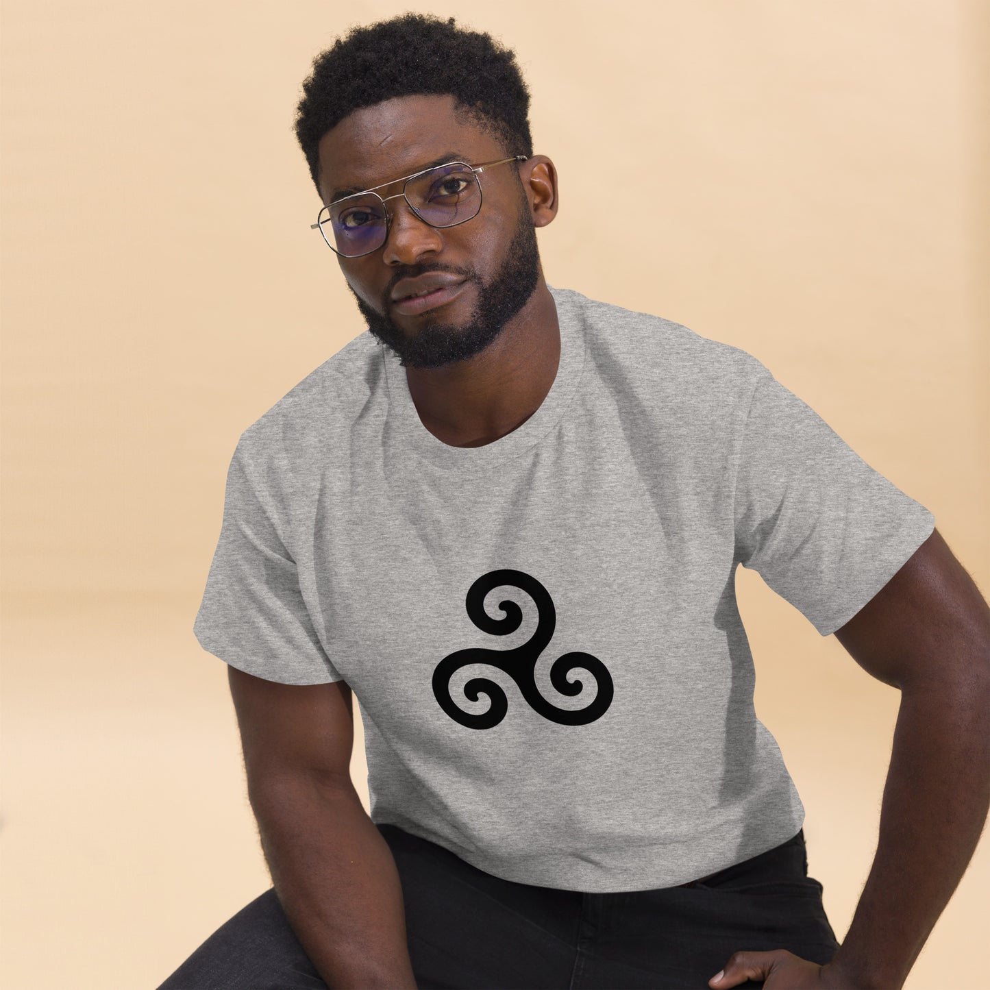 Triskelion T-Shirt design on a grey background.